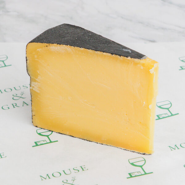 Cornish Kern is a hard gouda style cheese. Caramel coloured with a black wax rind