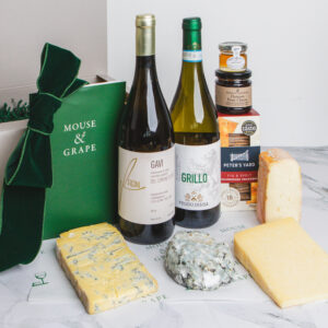 A hamper with two Italian white wines, four cheeses, crackers, fruit cheese and honey