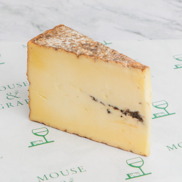 A yellow, semi-soft cheese with truffle