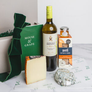 A white wine christmas hamper with one wine, two cheeses, crackers and honey